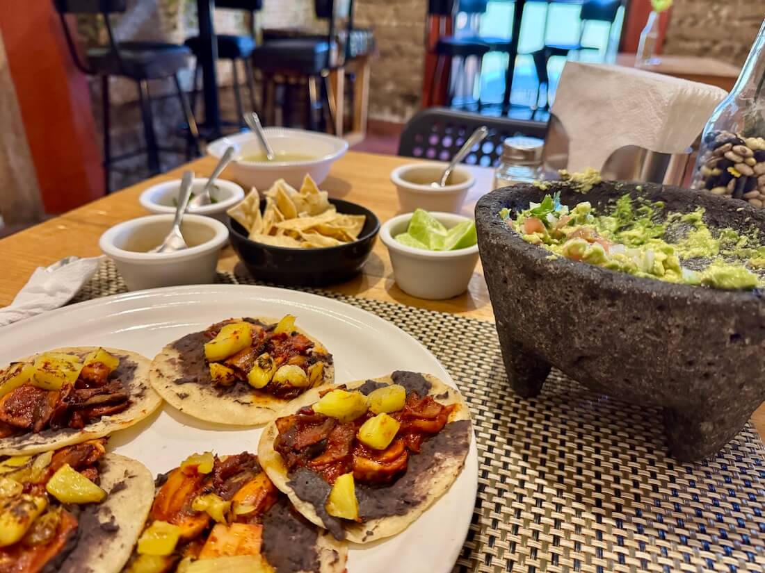 Eating tacos and guacamole is a must-do activity in Puebla, Mexico.