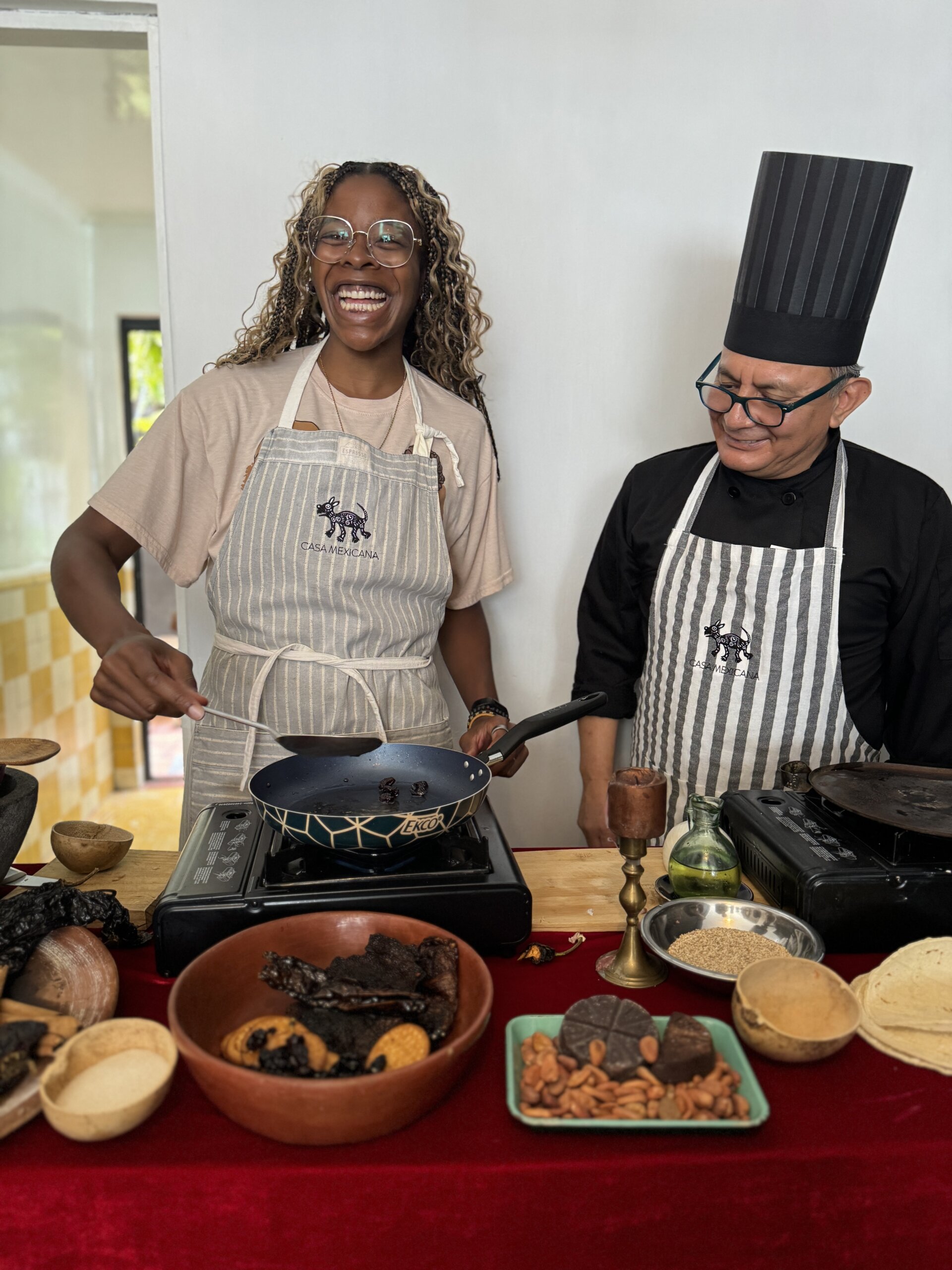 Me smiling with the chef during Casa Mexicana's cooking class in Puebla.