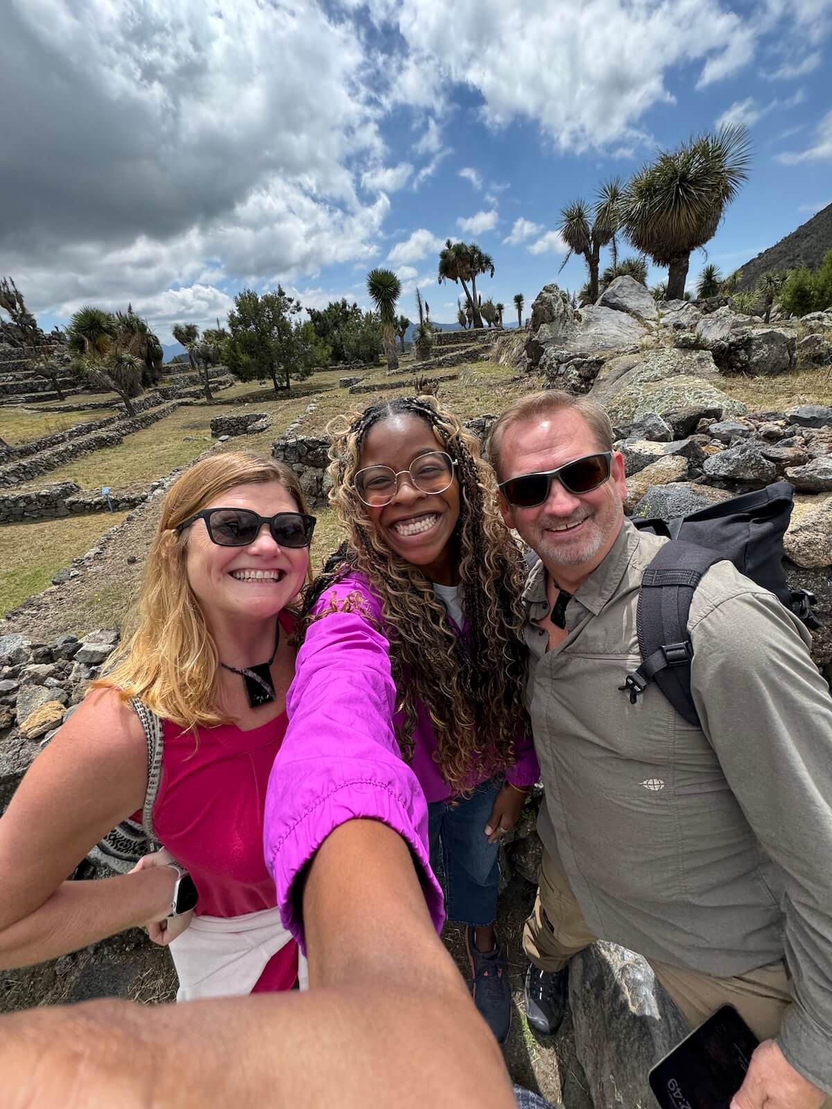 A photo of me smiling with fellow travel bloggers at ATMEX.