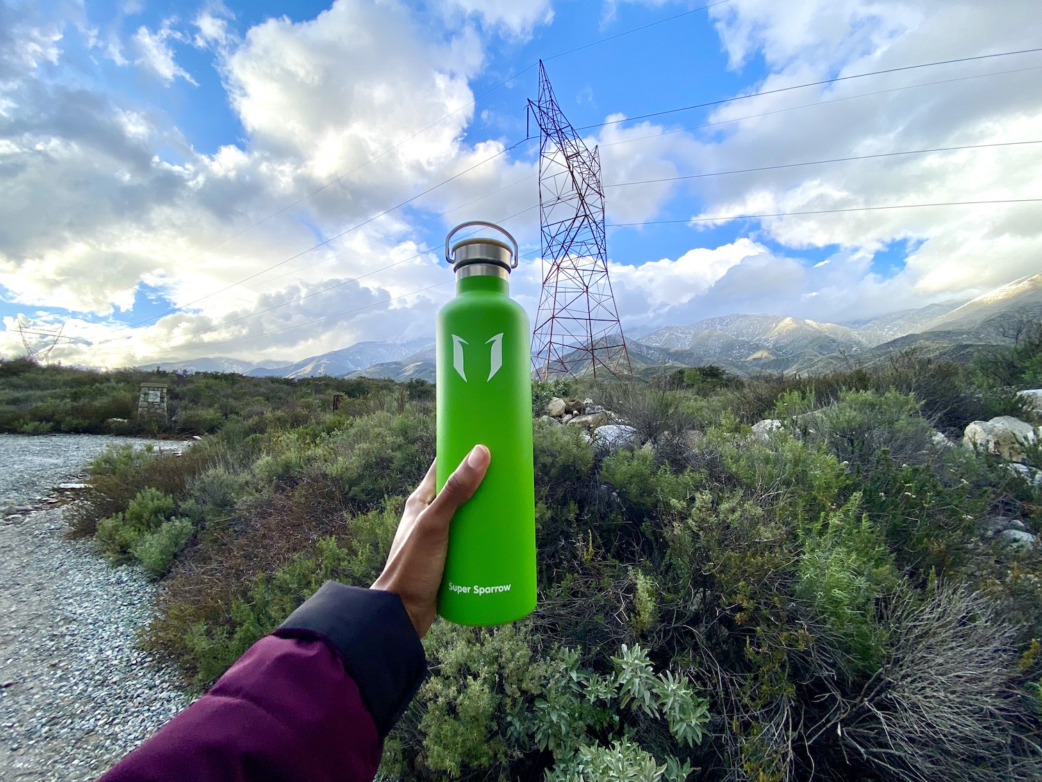 A green Super Sparrow water bottle 