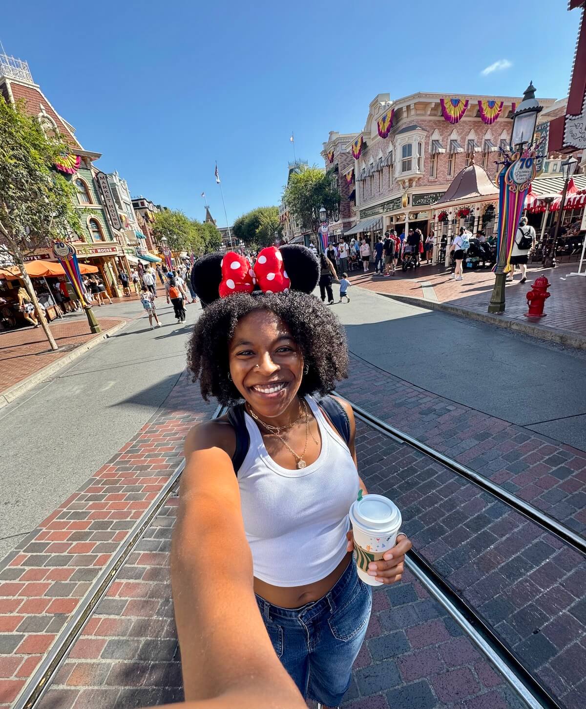 This is a photo of me at Disneyland, a popular theme park in California. 